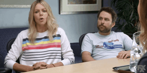 a gif of Dee from It's Always Sunny In Philadelphia. She is seated next to Charlie Day who is reacting with interested agreement as she says 'Where's the dong?'